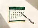 Akvarel af kalender med afkrydsede træningsdage