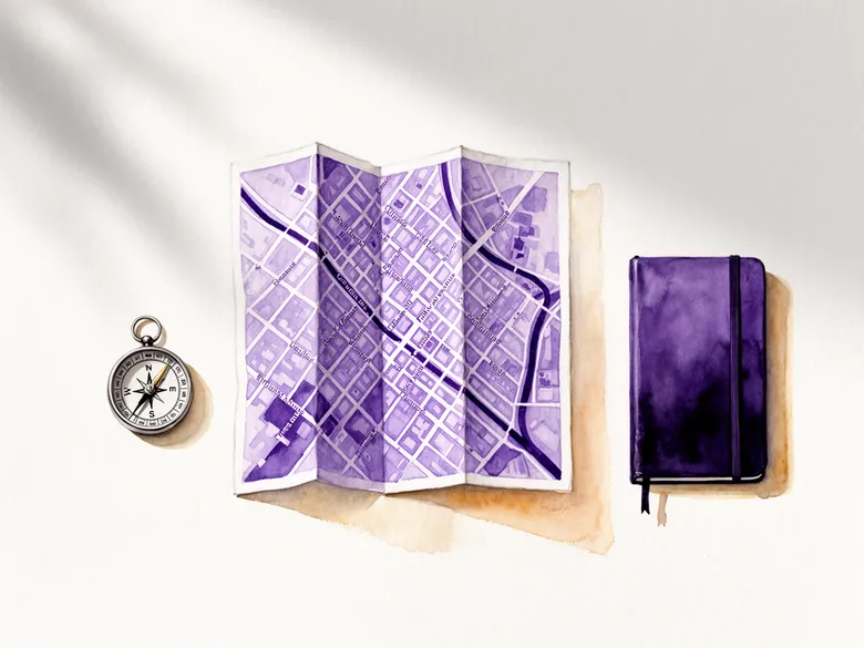 Akvarel af papirkort, kompas og notesbog